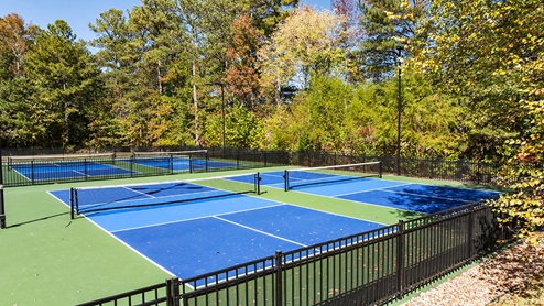 community amenity clubhouse with pickle ball courts