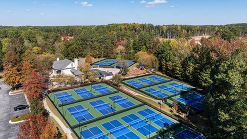 community amenity clubhouse with pickle ball courts