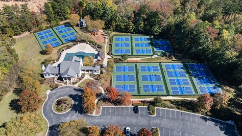 community amenity clubhouse with pickle ball courts