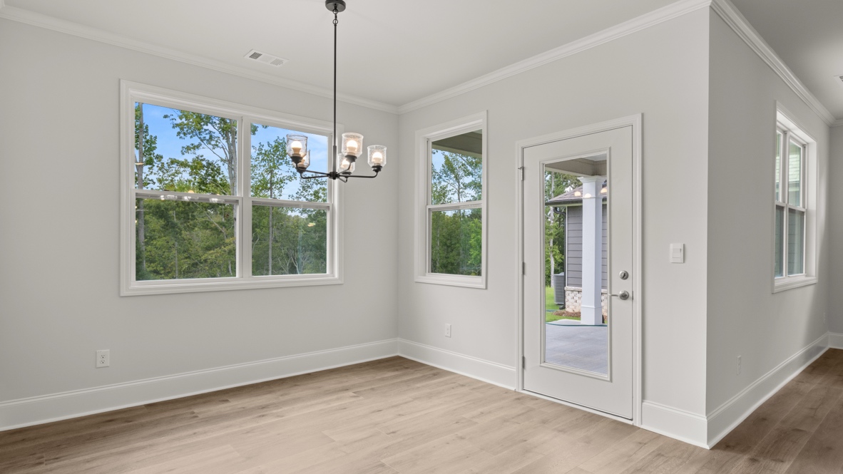 Interior living area with windows and back patio door