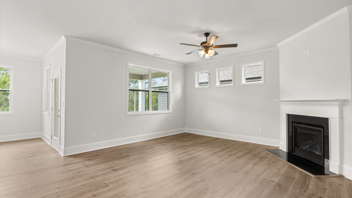 Interior living area with fire place and windows