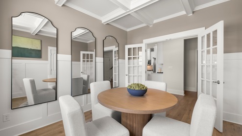 kitchen with white cabinetry, large island and stainless steel appliances