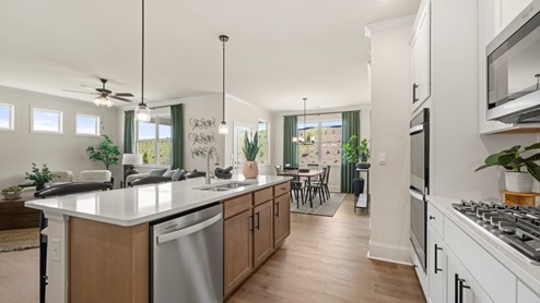 kitchen with white cabinetry, large island and stainless steel appliances