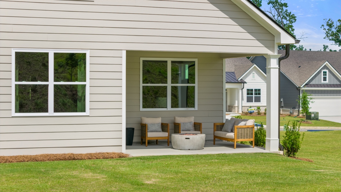 rear exterior of home featuring a covered concrete patio