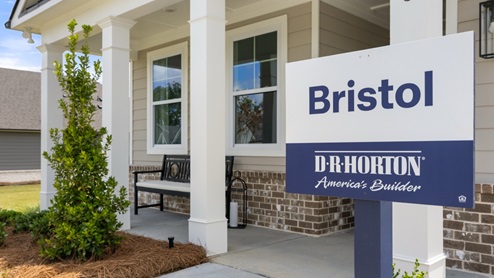 Front exterior of the Bristol model home with grey siding