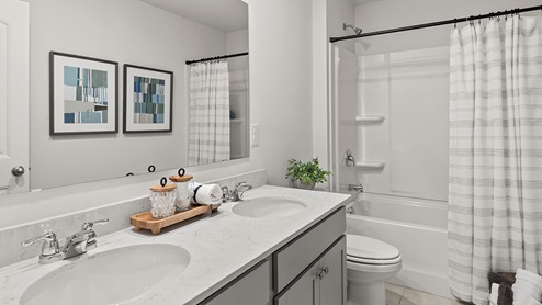 secondary bathroom on the second level with dual vanity