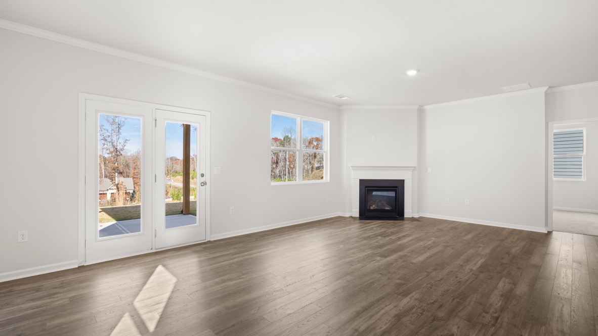 Interior living area with fire place and large windows