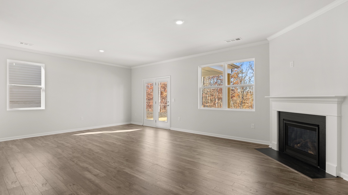 Interior living area with fire place and large windows