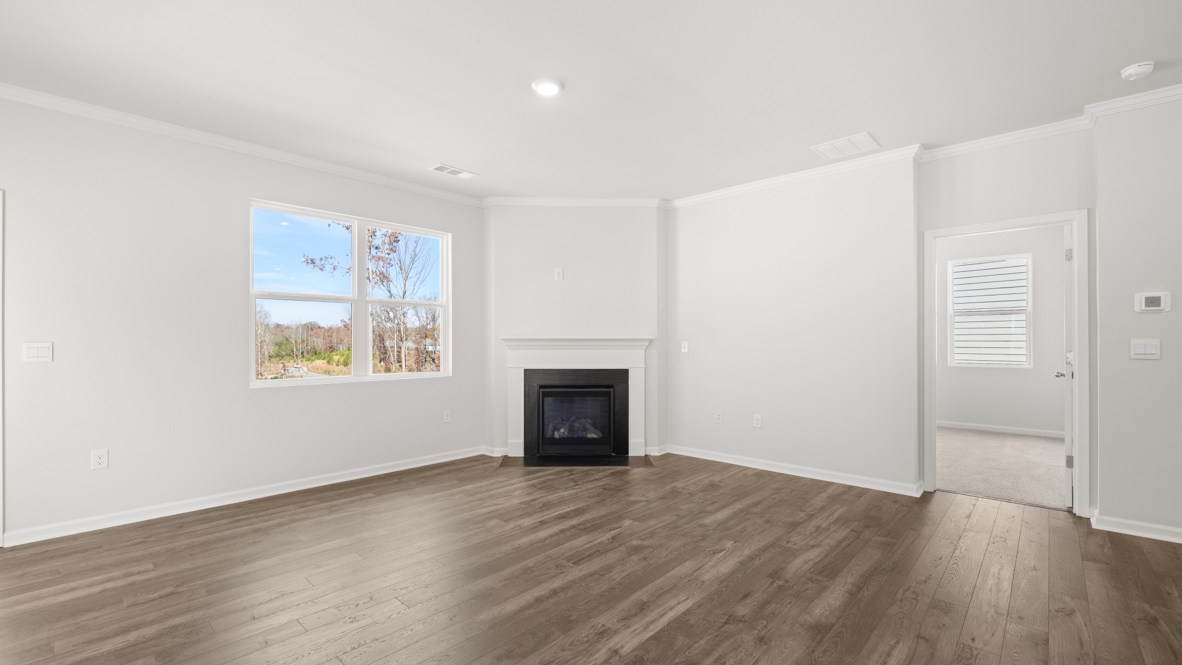 Interior living area with fire place and large windows