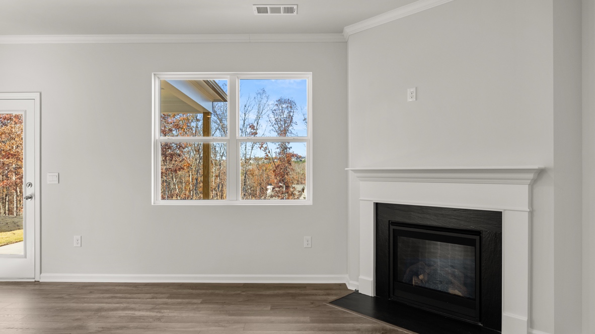 Interior living area with fire place and large windows