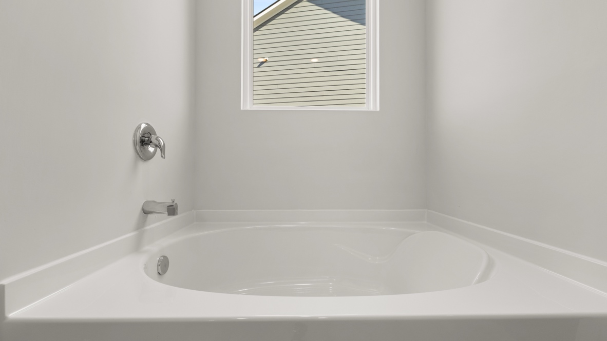 Interior primary bathroom with bath tub