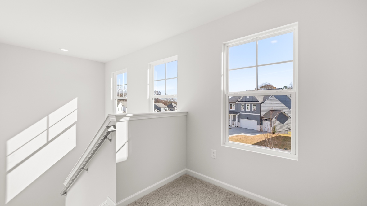 Interior upstairs loft area open to staircase
