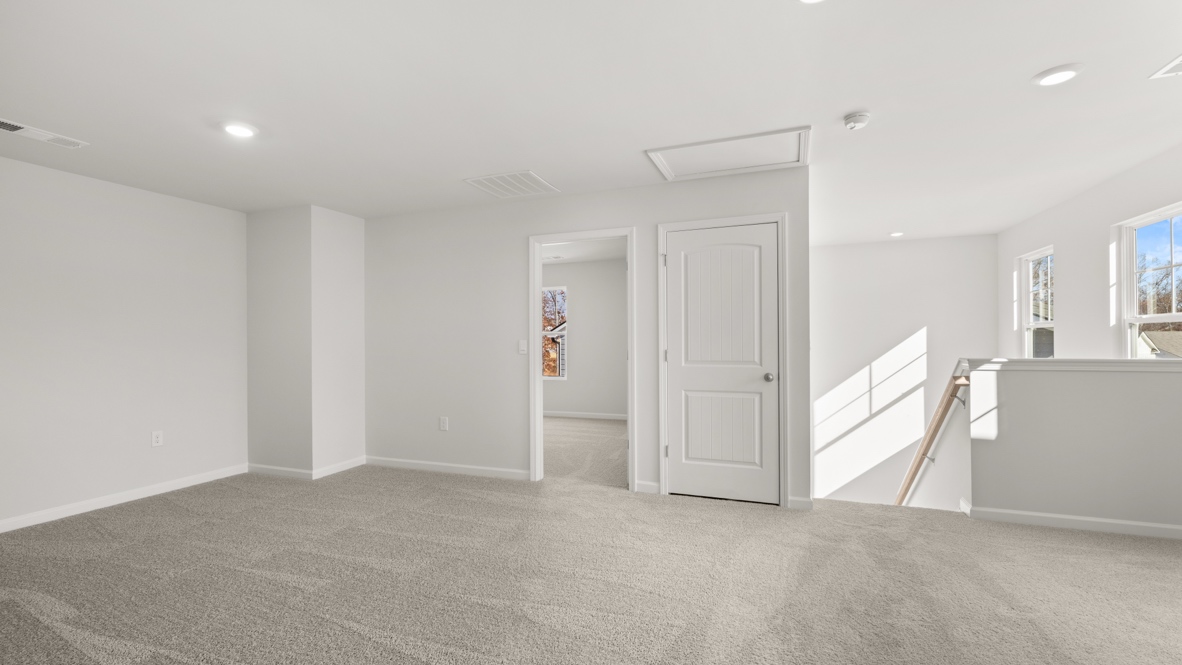 Interior upstairs loft area open to staircase