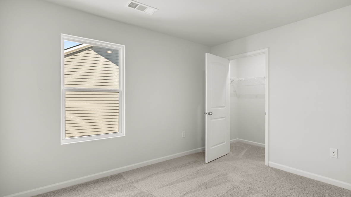 Interior bedroom with window and closet