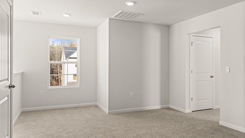 Interior upstairs loft area with large windows