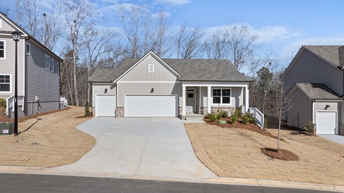 Exterior light grey home with stone detailing