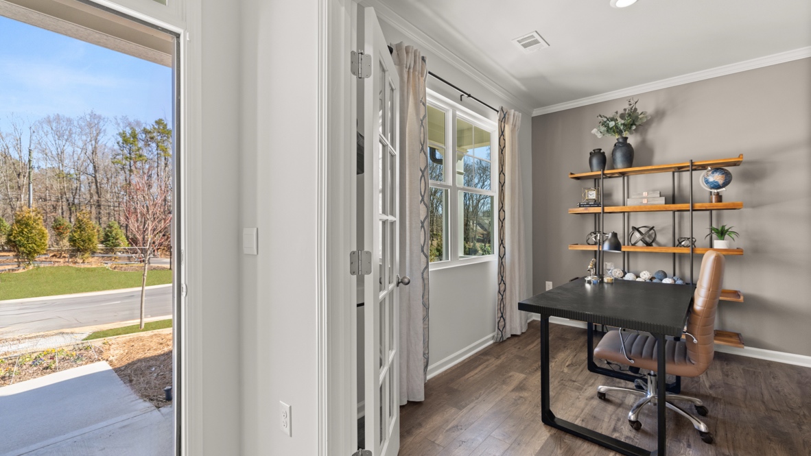 Interior entry-way next to office with large window