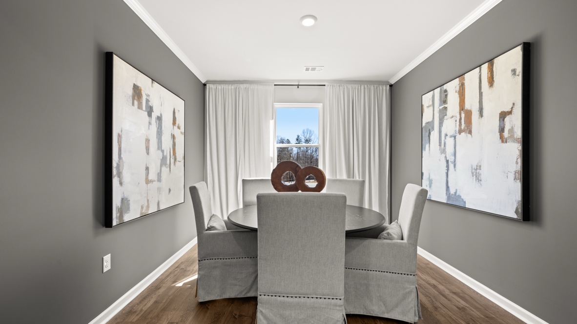 Interior dining area with large window and accent walls