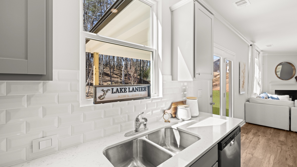 Interior kitchen with center island and light grey cabinets