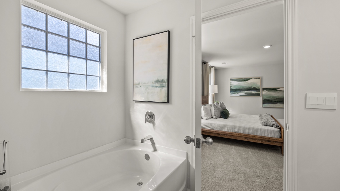 Interior primary bathroom with bath tub