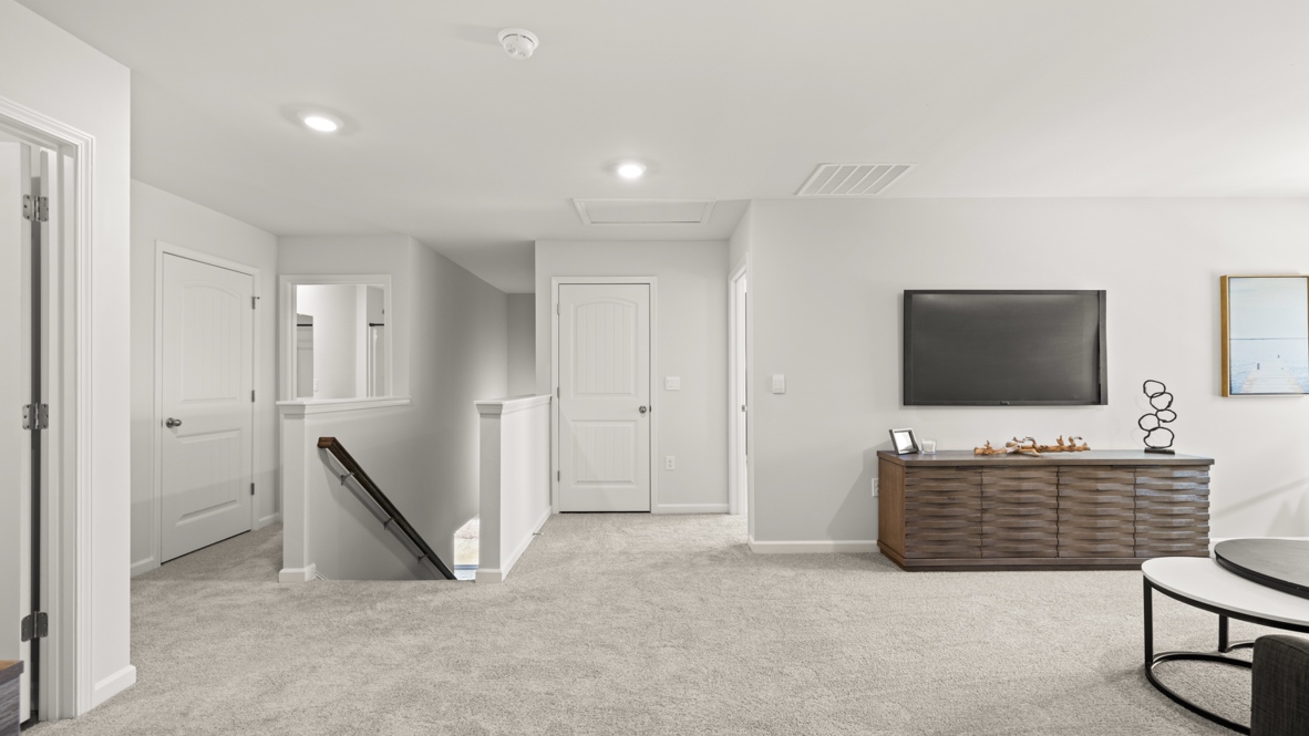 Interior upstairs loft area open to staircase