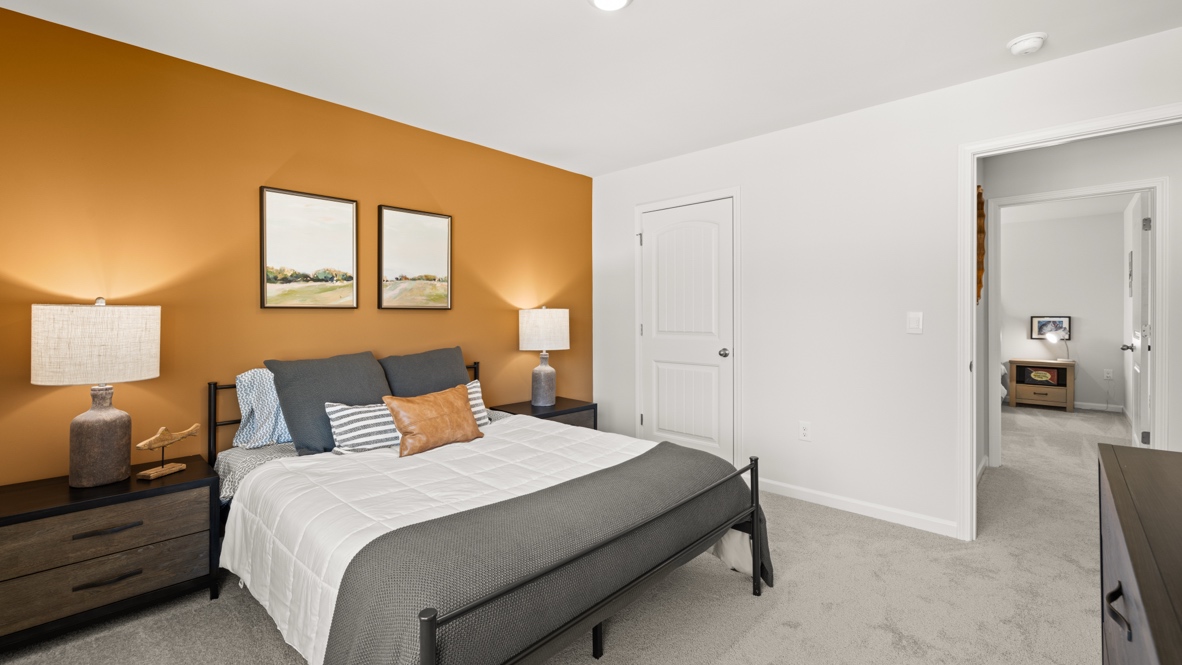 Interior bedroom with large window and accent wall