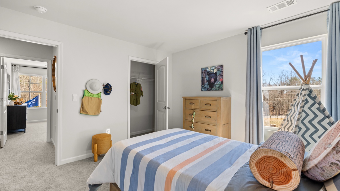 Interior bedroom with window and closet