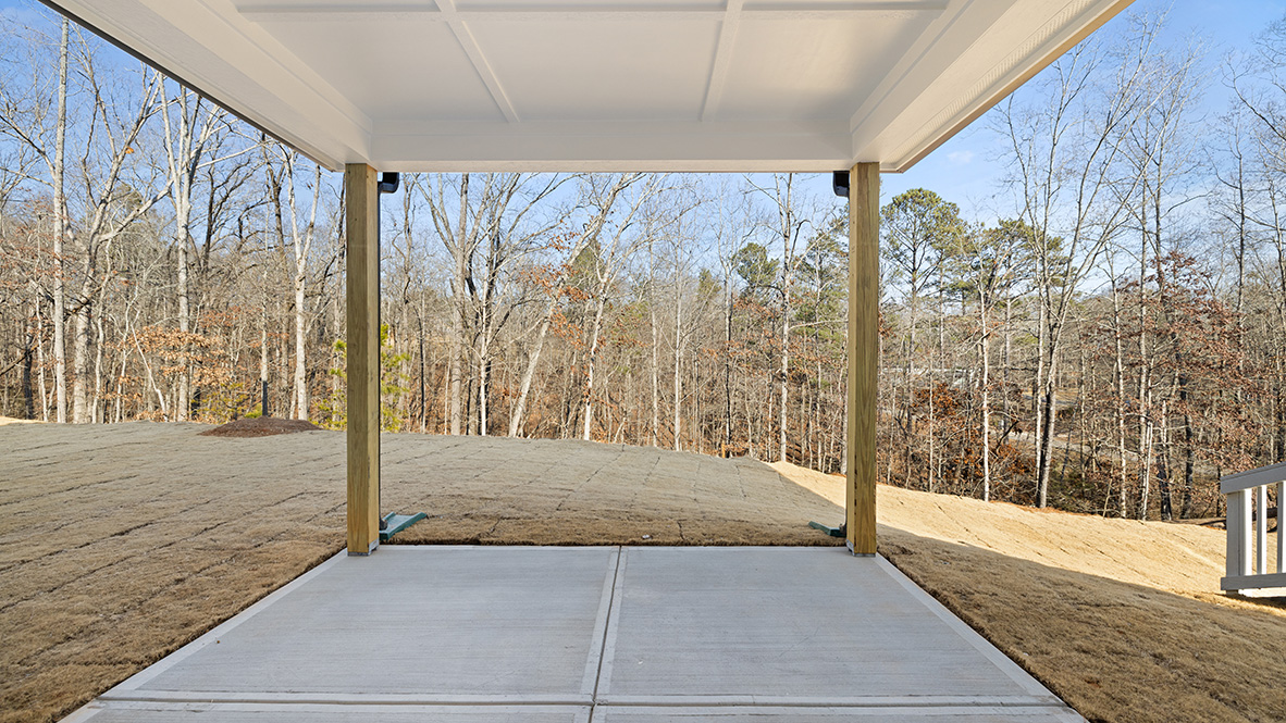 rear exterior of home featuring a covered concrete patio