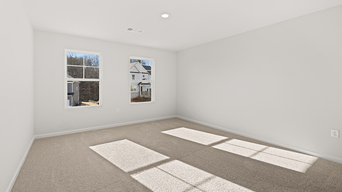 Bedroom 2 has two single windows and neutral carpet.