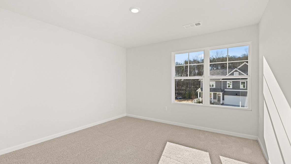 Bedroom 3 has a double window and neutral carpet.