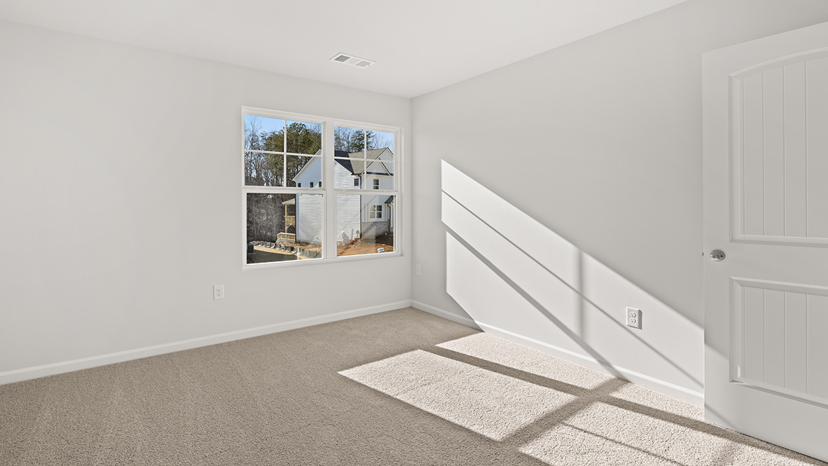 Bedroom 3 has a double window and neutral carpet.