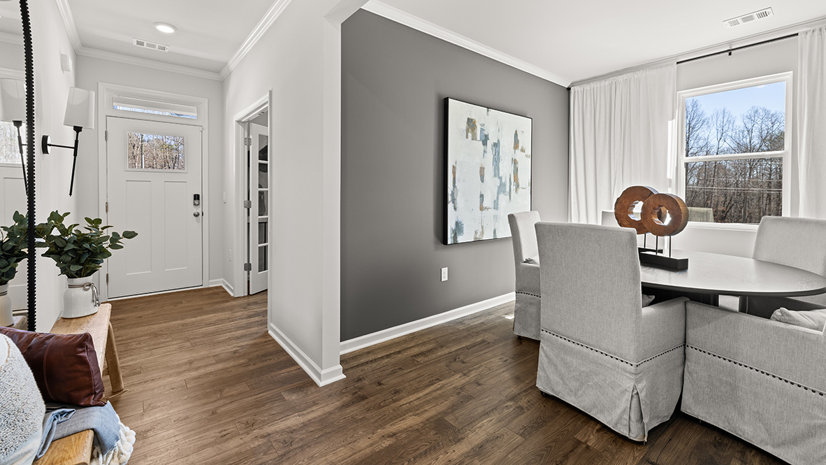 Interior dining area with access to the entryway