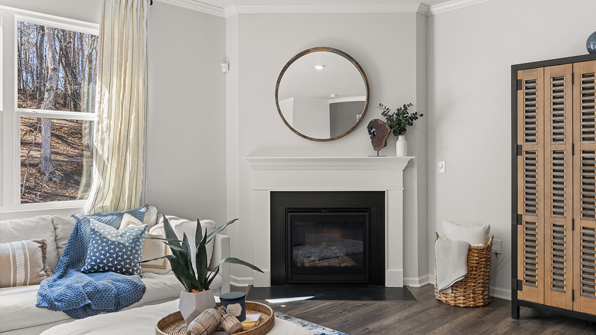 Interior living area with fire place and large windows