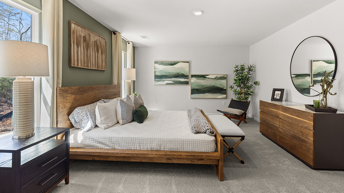 Interior primary bedroom with windows