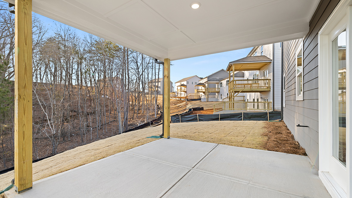 rear exterior of home featuring a covered concrete patio