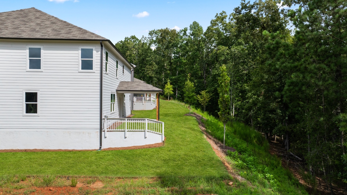 rear exterior of home featuring a covered concrete patio