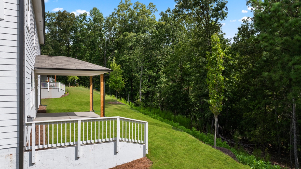 rear exterior of home featuring a covered concrete patio