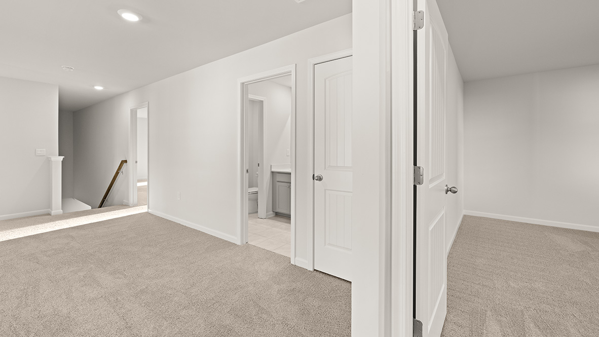 Second floor living area with stairs and bathroom