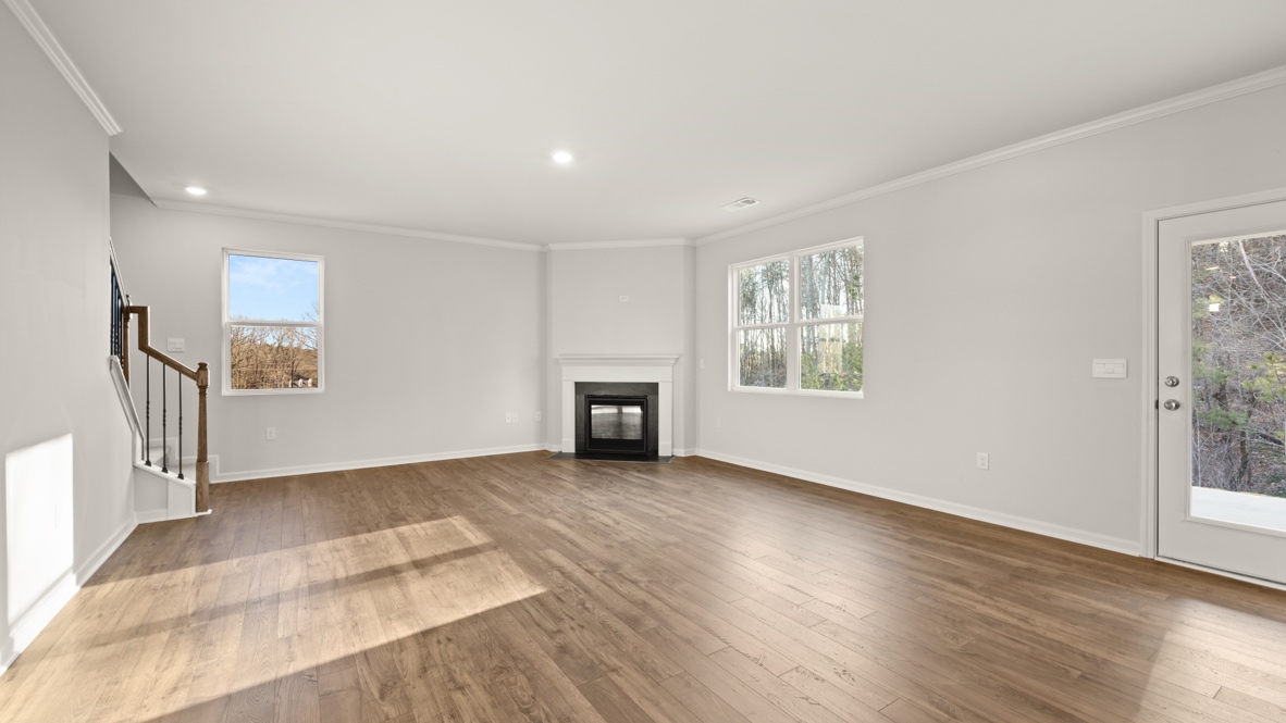 Interior living area with fire place and large windows