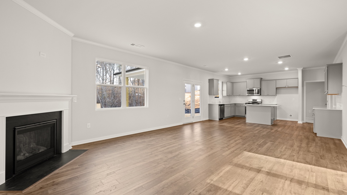 Interior living area with fire place and large windows