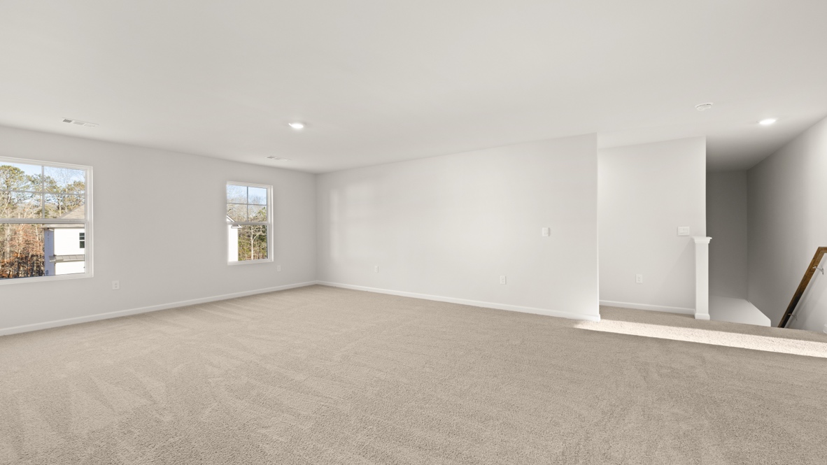 Interior upstairs loft area open to to staircase