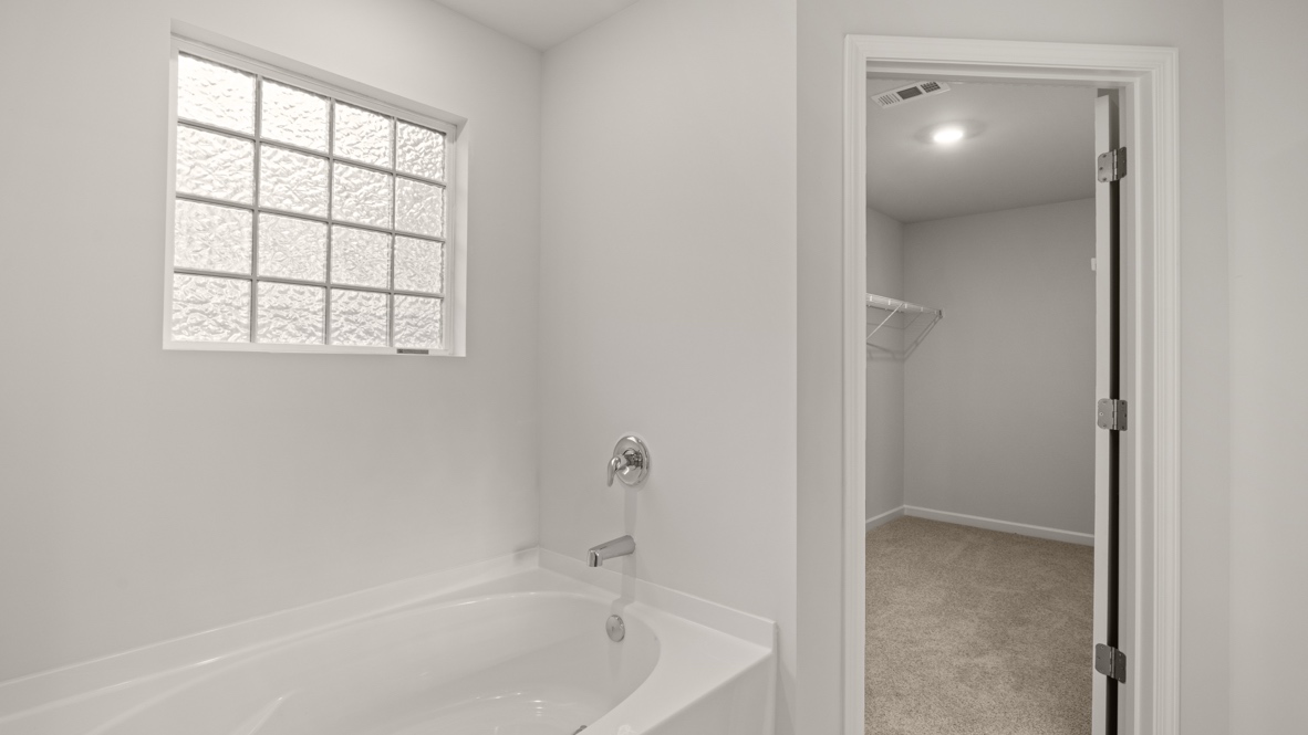 Interior primary bathroom with bath tub