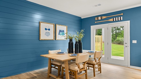 Dining room with a glass backdoor.