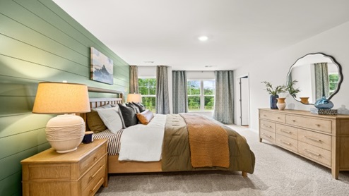 Interior bedroom with accent wall and windows