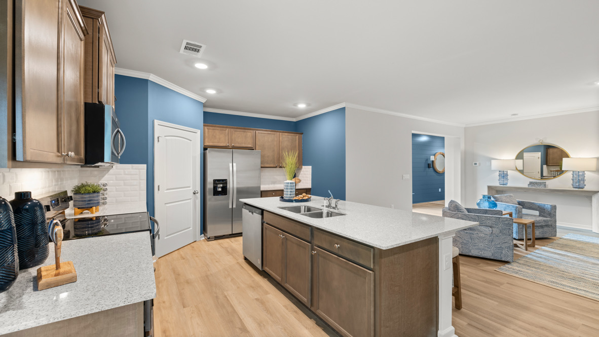 Interior kitchen with center island and wooden cabinets