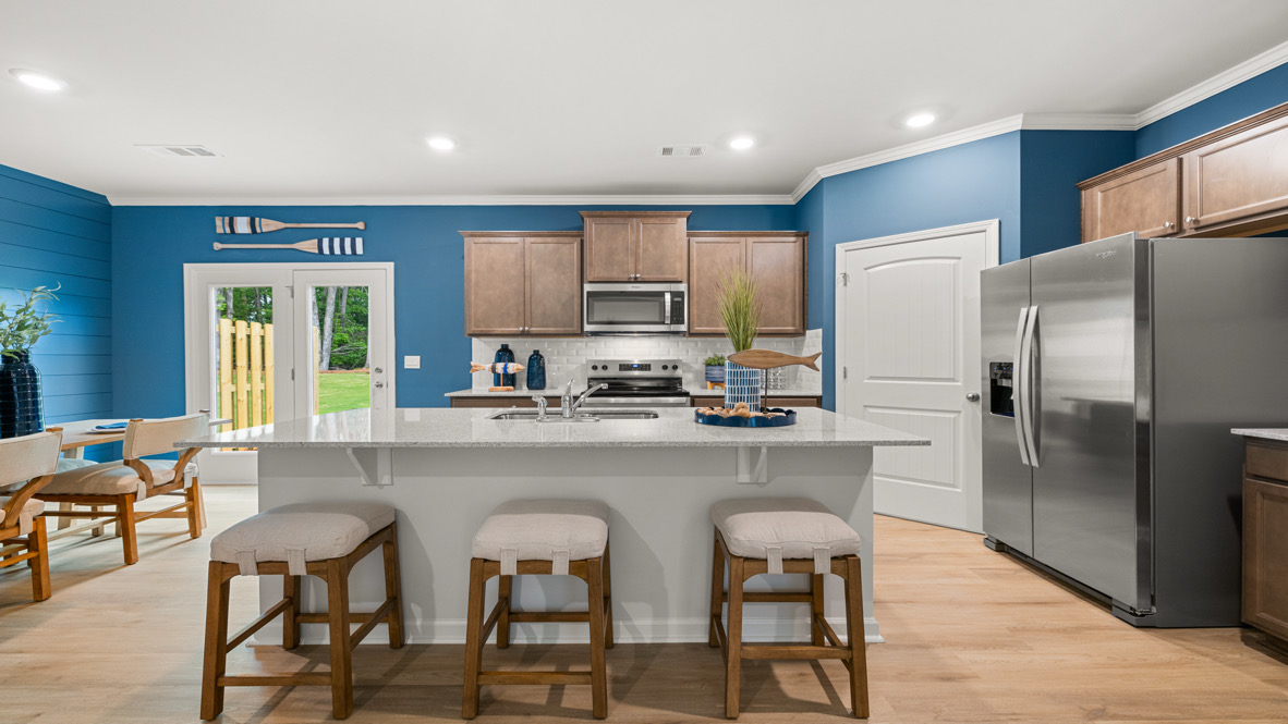 Interior kitchen with center island and wooden cabinets