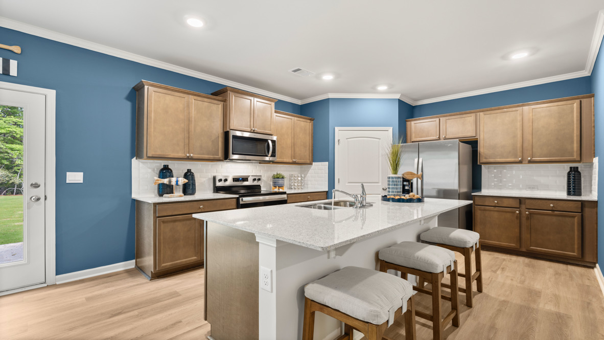Interior kitchen with center island and wooden cabinets