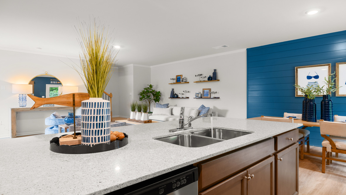 Interior kitchen with center island and wooden cabinets