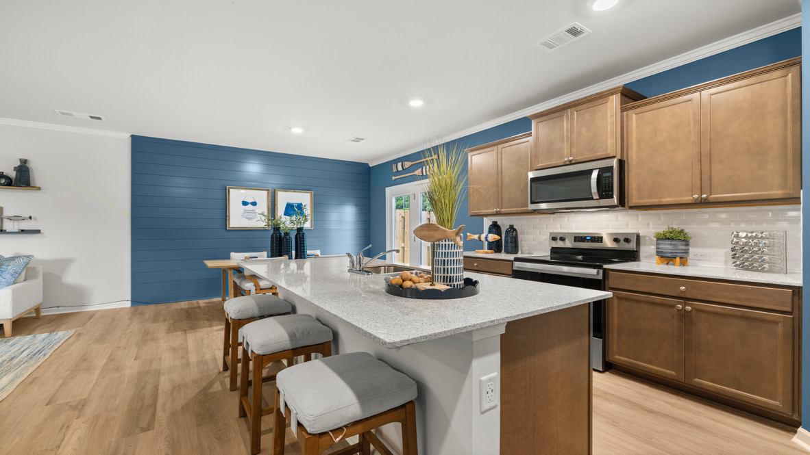 Interior kitchen with center island and wooden cabinets