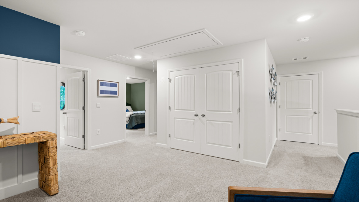 Interior upstairs loft area open to staircase